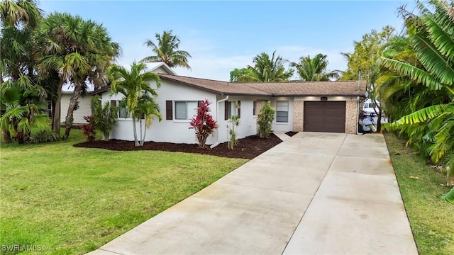 ranch-style home featuring a garage, concrete driveway, a front lawn, and stucco siding