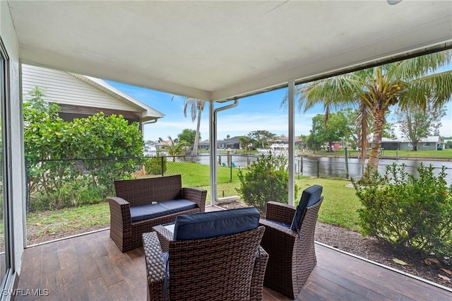 sunroom with a water view