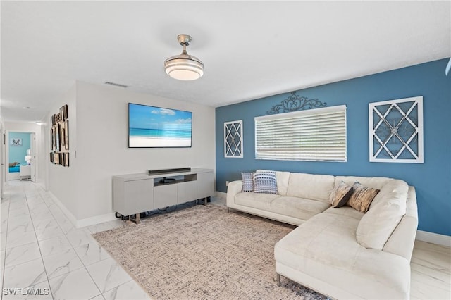 living room with visible vents, marble finish floor, and baseboards