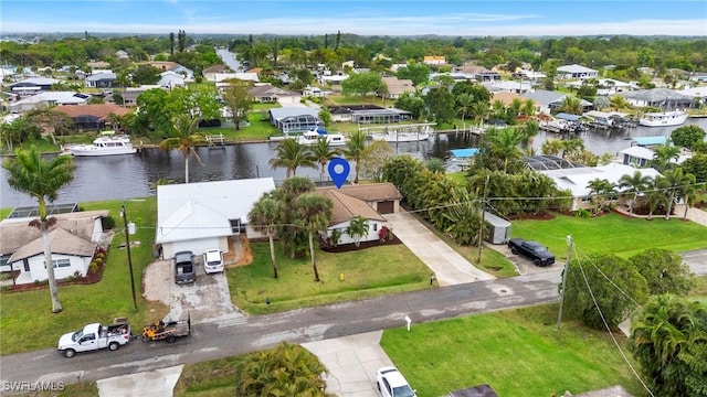 aerial view with a residential view and a water view