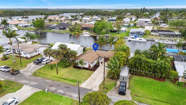 birds eye view of property with a residential view and a water view