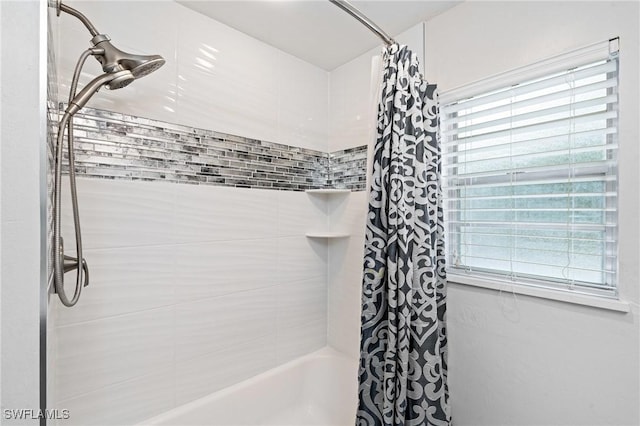 bathroom featuring shower / tub combo with curtain