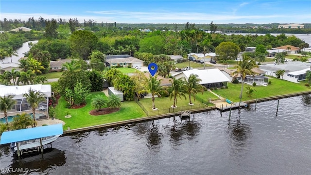 bird's eye view with a water view and a residential view