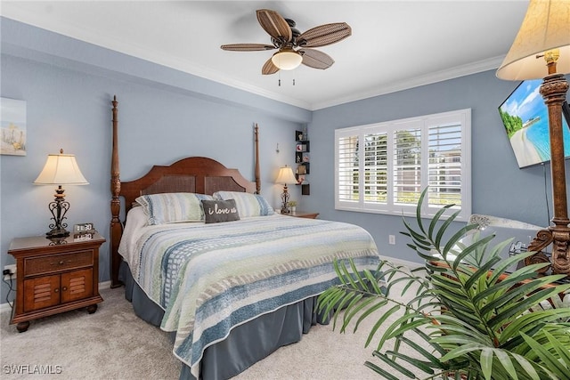 bedroom with ceiling fan, baseboards, carpet, and ornamental molding