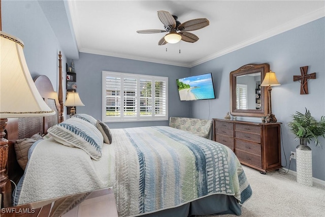 bedroom with crown molding, carpet flooring, a ceiling fan, and baseboards