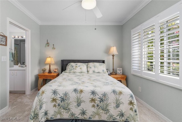 bedroom featuring baseboards, a sink, ornamental molding, ensuite bathroom, and carpet flooring