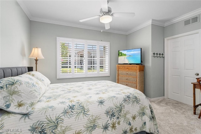 bedroom featuring baseboards, visible vents, carpet floors, ceiling fan, and ornamental molding