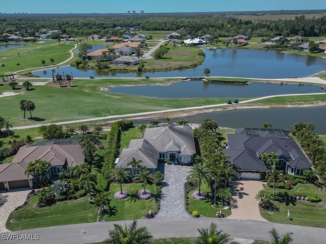 drone / aerial view featuring a water view and a residential view