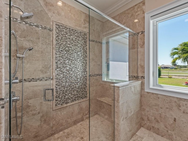 full bath featuring a shower stall and ornamental molding