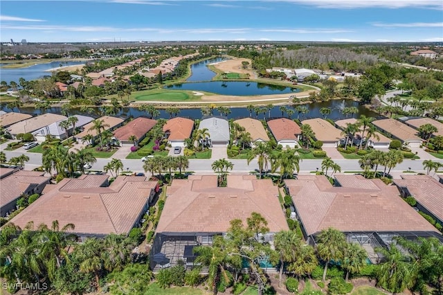 bird's eye view featuring a water view and a residential view