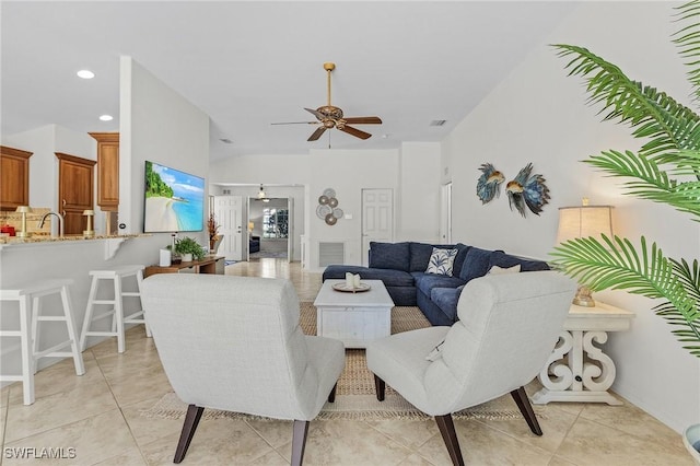 living room with vaulted ceiling, light tile patterned floors, recessed lighting, and ceiling fan