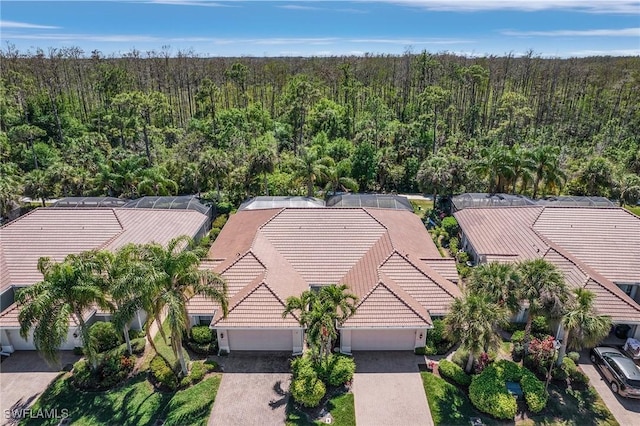 drone / aerial view featuring a view of trees