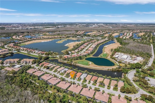 aerial view featuring a residential view and a water view