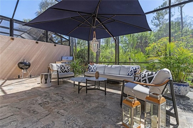 view of patio / terrace with glass enclosure and an outdoor living space