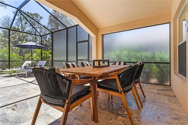 sunroom featuring lofted ceiling