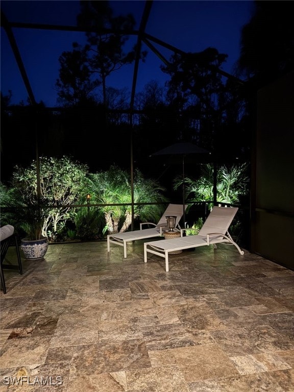 yard at twilight featuring a patio