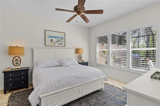 bedroom with baseboards and ceiling fan