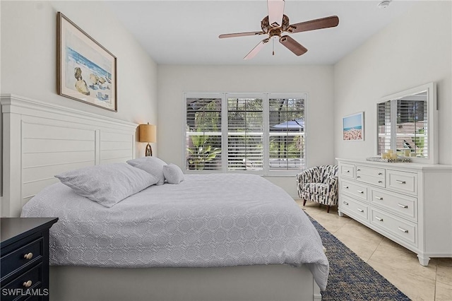 bedroom featuring light tile patterned floors and a ceiling fan