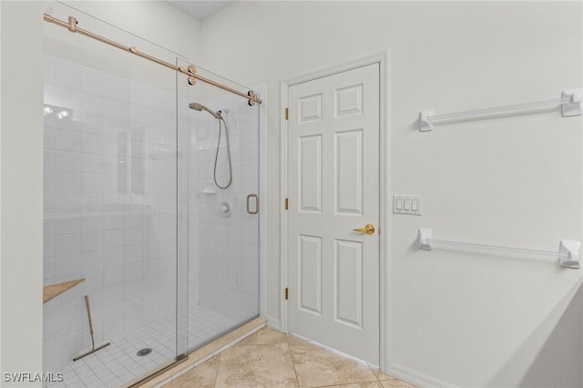 full bath with tile patterned floors and a stall shower