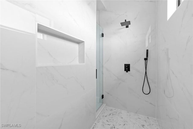 bathroom with a marble finish shower and marble finish floor