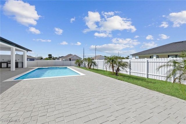 view of pool featuring a fenced in pool, a patio, and a fenced backyard