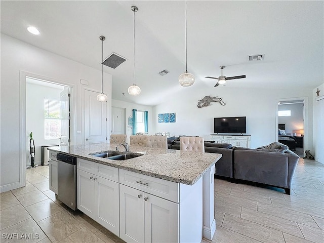 kitchen featuring dishwasher, open floor plan, visible vents, and a sink