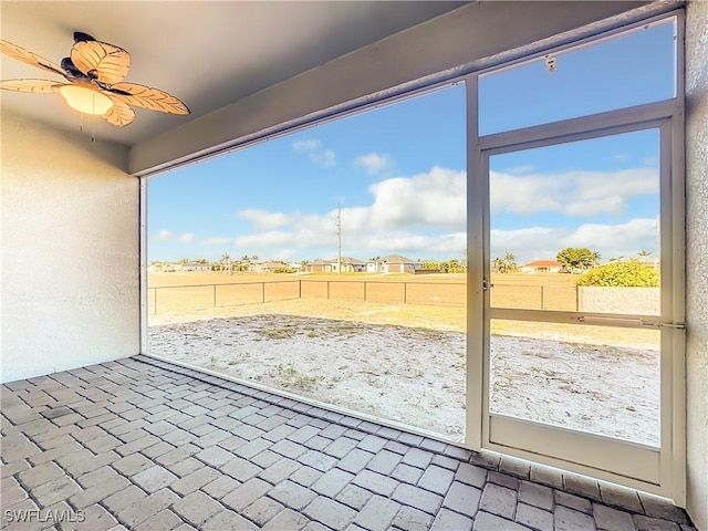 exterior space featuring a ceiling fan