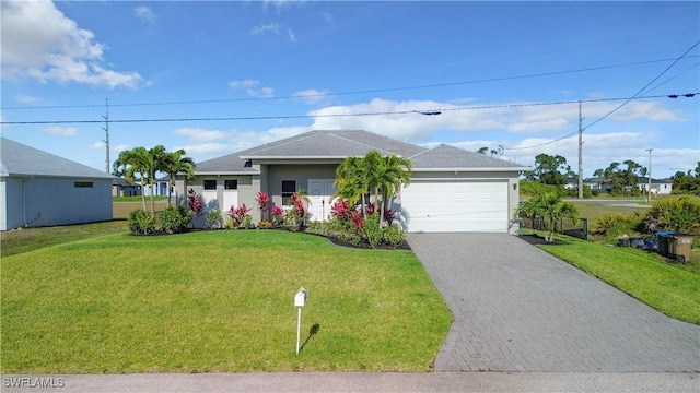 single story home featuring a garage, stucco siding, driveway, and a front lawn