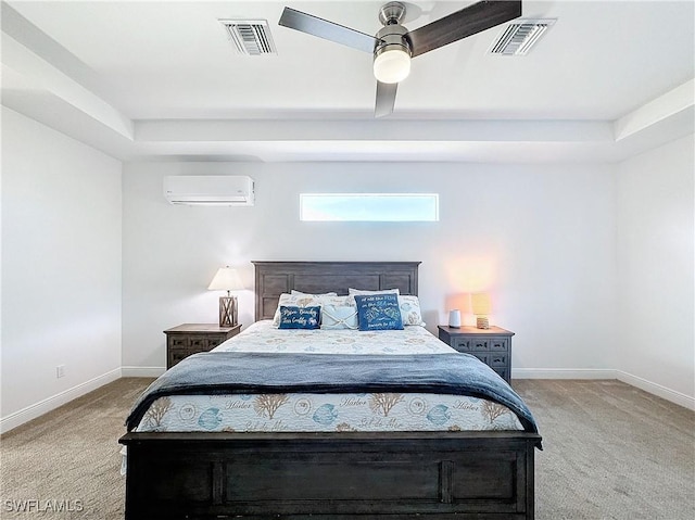 bedroom with visible vents, light colored carpet, and an AC wall unit