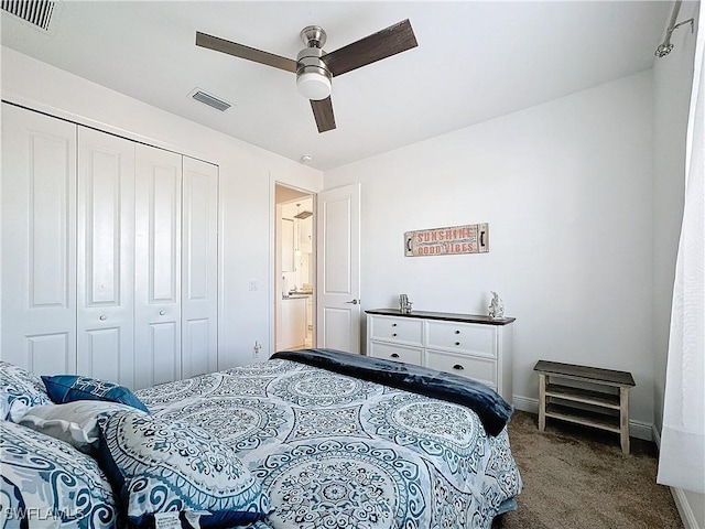 carpeted bedroom with visible vents, baseboards, a closet, and a ceiling fan