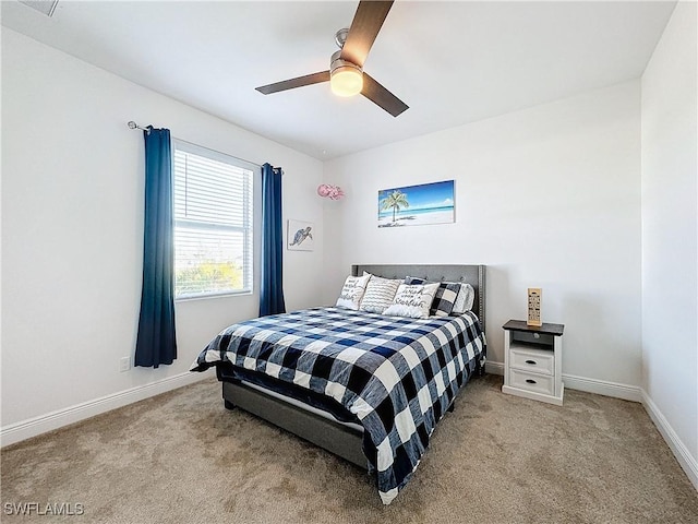 bedroom featuring baseboards, carpet, and a ceiling fan