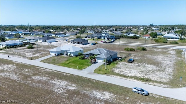 birds eye view of property with a residential view