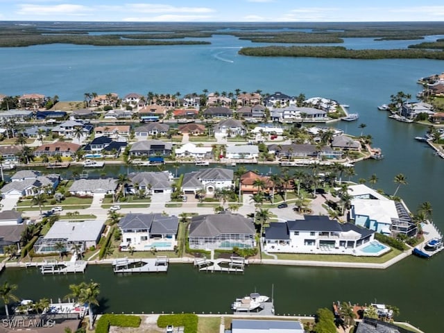 bird's eye view with a residential view and a water view