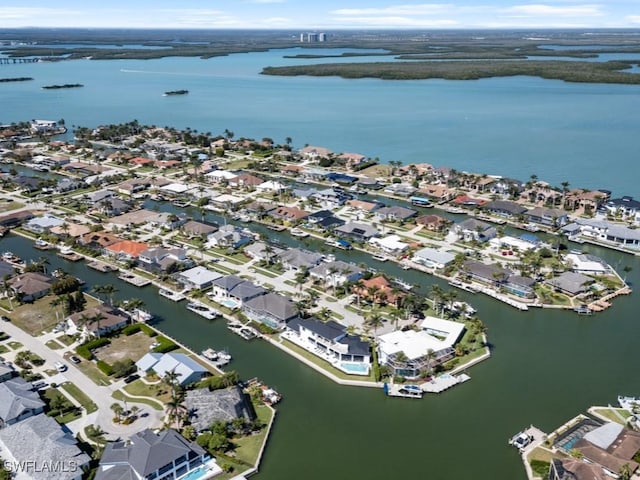 aerial view featuring a residential view and a water view