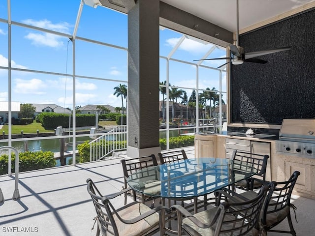 view of patio with outdoor dining space, a lanai, and area for grilling