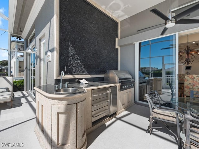 view of patio / terrace featuring area for grilling, a grill, ceiling fan, and a sink