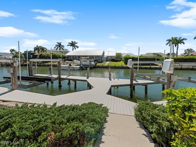 view of dock featuring boat lift and a water view