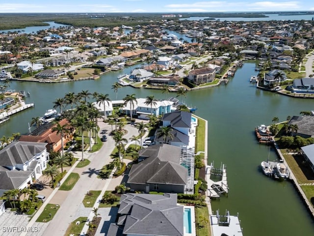 bird's eye view with a water view and a residential view