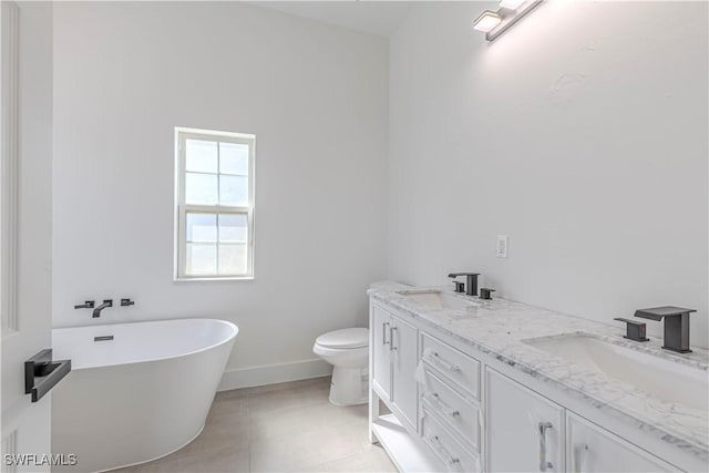 full bath with a sink, toilet, double vanity, and a soaking tub