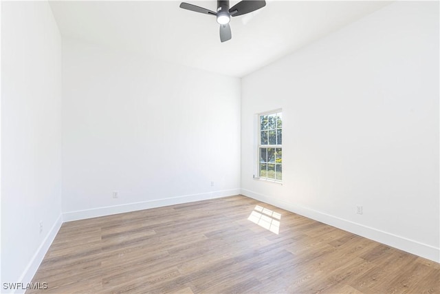 unfurnished room featuring wood finished floors, baseboards, and ceiling fan