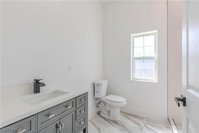 full bath with baseboards, toilet, marble finish floor, and vanity