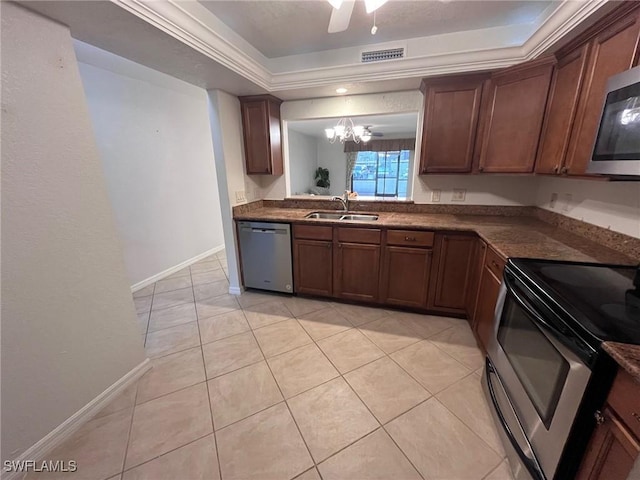 kitchen featuring visible vents, a sink, dark countertops, stainless steel appliances, and light tile patterned flooring