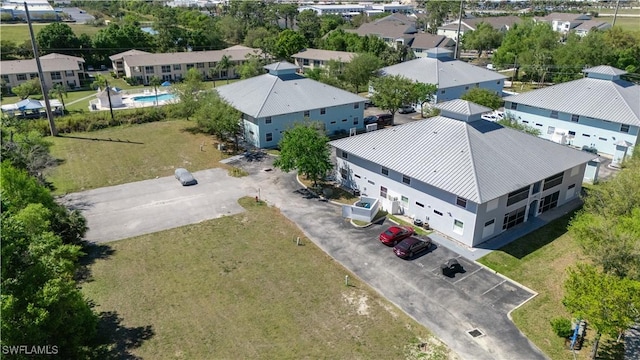 birds eye view of property with a residential view