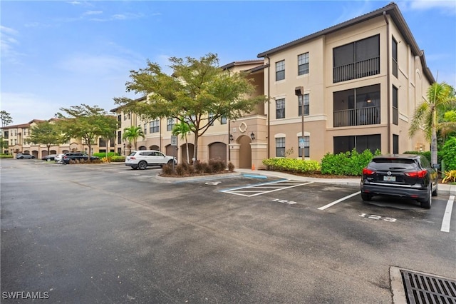 view of property featuring uncovered parking