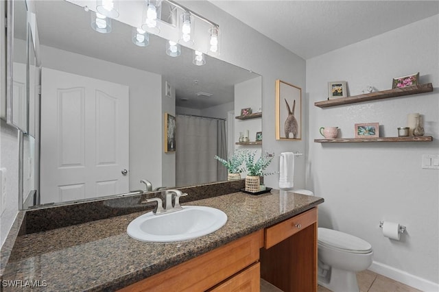 full bath featuring a shower with curtain, toilet, tile patterned flooring, baseboards, and vanity