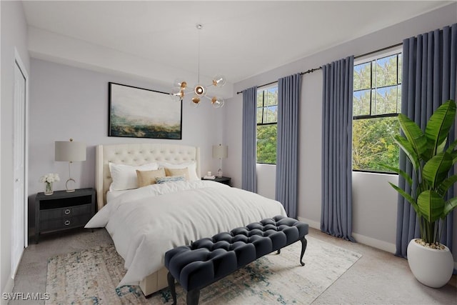 12965 Positano Cir Unit 304, Naples, FL 34105 - bedroom with carpet flooring, baseboards, and a chandelier