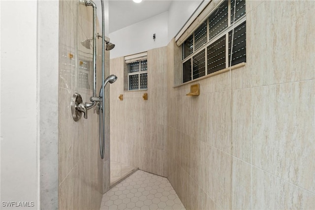 full bathroom featuring tiled shower