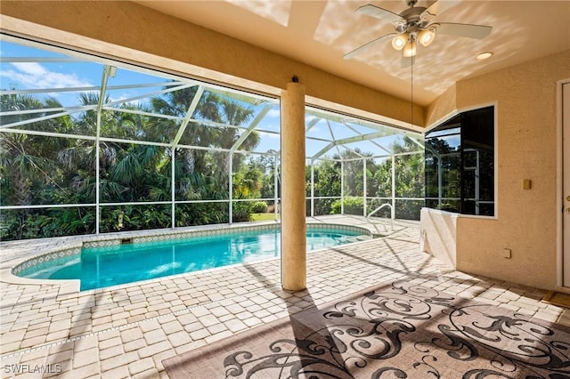 pool with a ceiling fan, a lanai, and a patio area