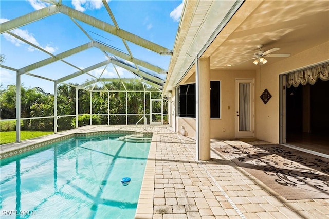 pool featuring a patio, a lanai, and a ceiling fan