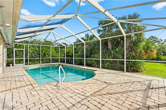 outdoor pool featuring a lanai and a patio area